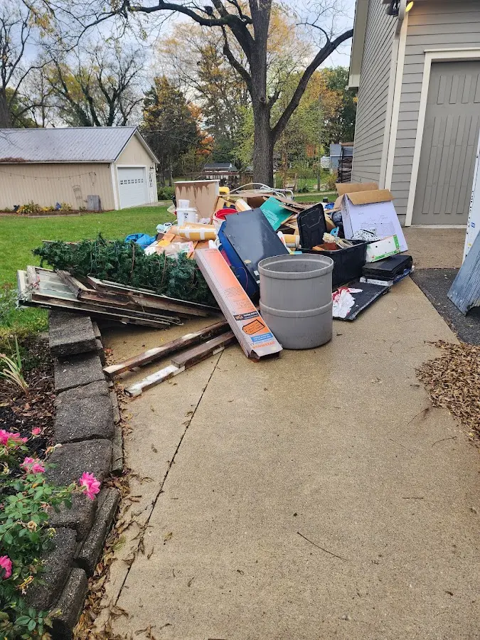 Dumpster being loaded with debris for 30 Yard Dumpster Rental in Waterville